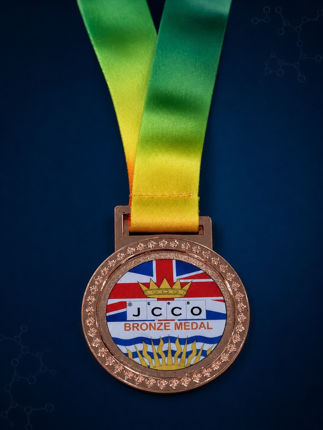 เหรียญทองแดง JCCO ด้านหน้าพร้อมริบบิ้น